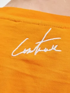 Tops & T-Shirts*The Couture Club  Crop-Top mit mehrlagigem Gothic-Print in Orange