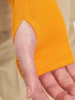 Tops & T-Shirts*The Couture Club  Crop-Top mit mehrlagigem Gothic-Print in Orange