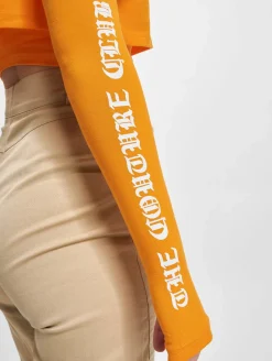 Tops & T-Shirts*The Couture Club  Crop-Top mit mehrlagigem Gothic-Print in Orange