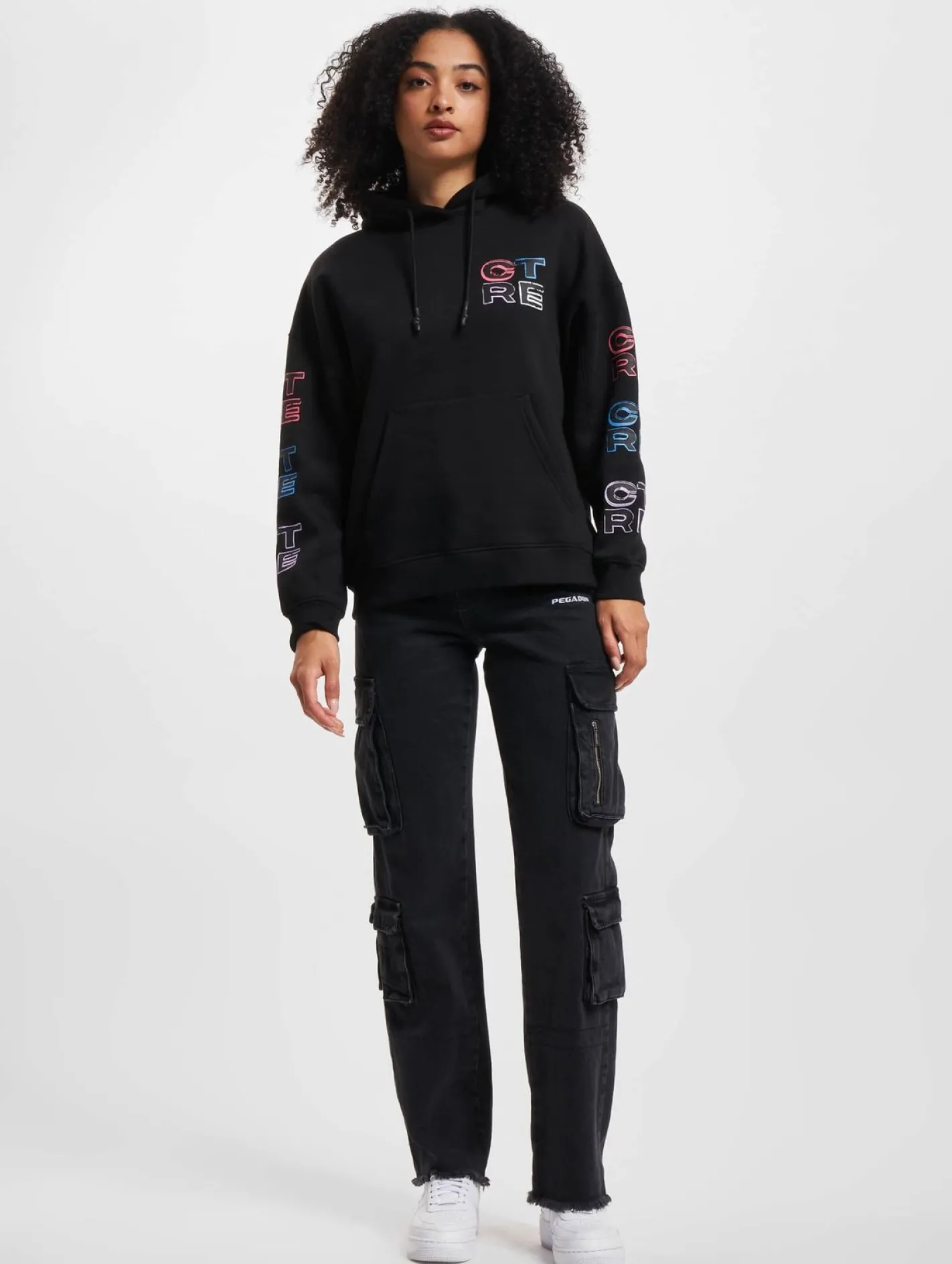 Sweater & Pullover*The Couture Club Oversize-Kapuzenpullover mit mehrfarbiger Grafik in Schwarz