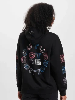 Sweater & Pullover*The Couture Club Oversize-Kapuzenpullover mit mehrfarbiger Grafik in Schwarz