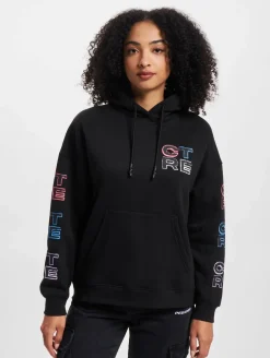 Sweater & Pullover*The Couture Club Oversize-Kapuzenpullover mit mehrfarbiger Grafik in Schwarz