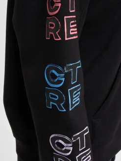 Sweater & Pullover*The Couture Club Oversize-Kapuzenpullover mit mehrfarbiger Grafik in Schwarz